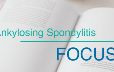 Photo illustration of blurred text with overlay that reads ankylosing spondylitis, focus.